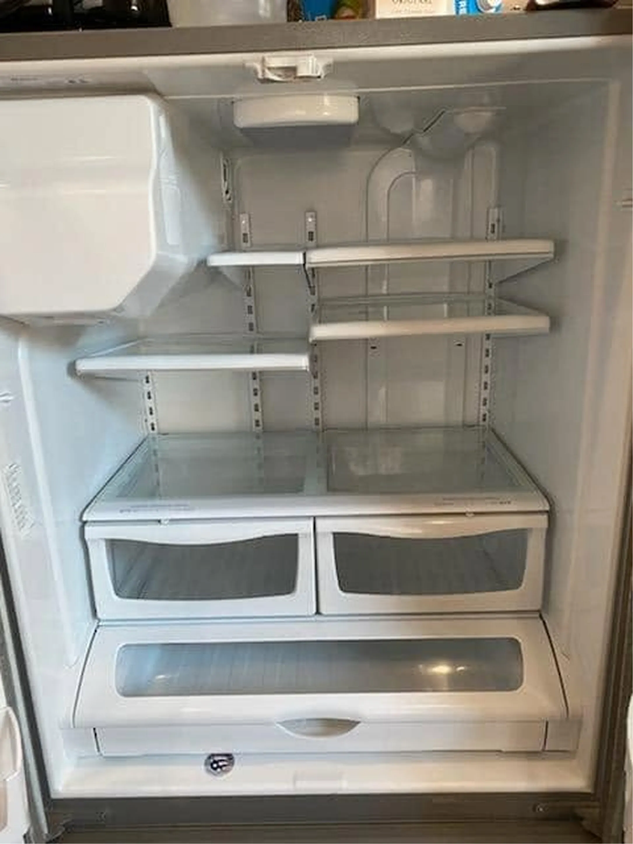 Refrigerator interior, cleaned and wiped down